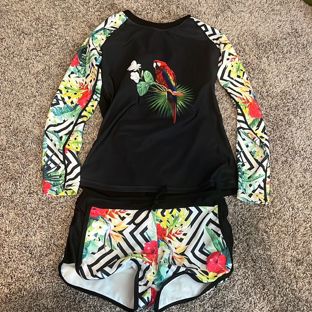 Long sleeve, colorful, floral swim suit with fun shorts and cute design! Size S.